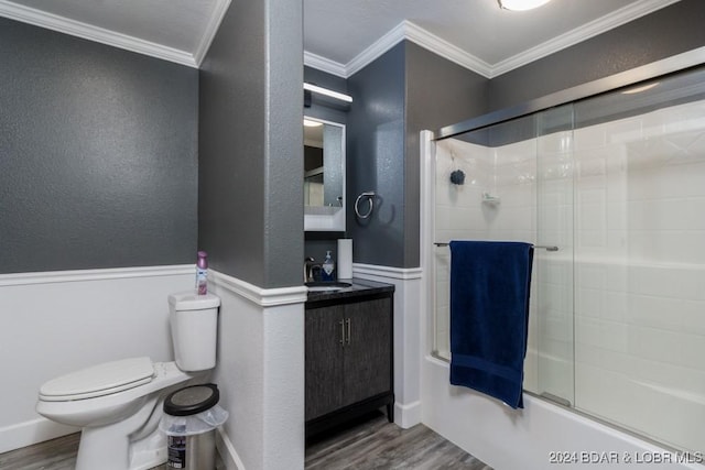 full bathroom featuring sink, crown molding, wood-type flooring, toilet, and shower / bath combination with glass door