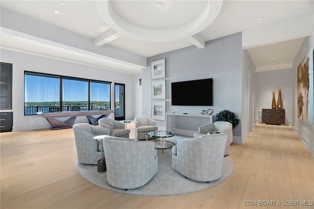 living room with light hardwood / wood-style floors and beam ceiling