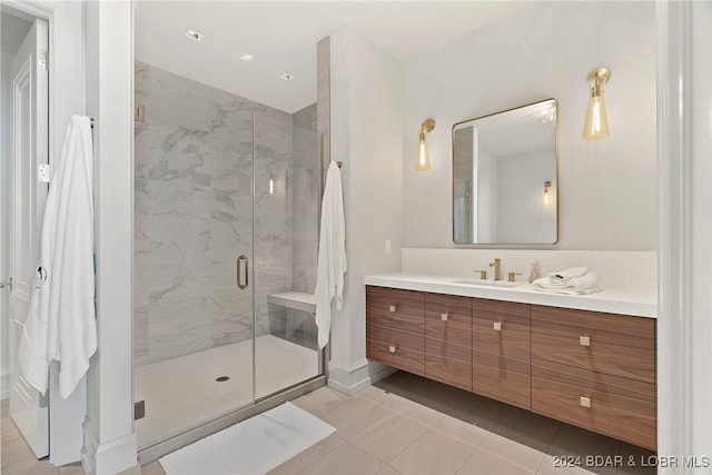 bathroom featuring vanity, tile patterned floors, and an enclosed shower