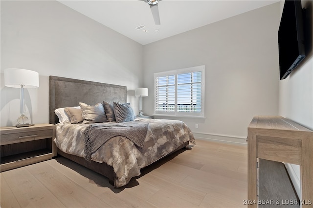 bedroom featuring ceiling fan and light hardwood / wood-style flooring