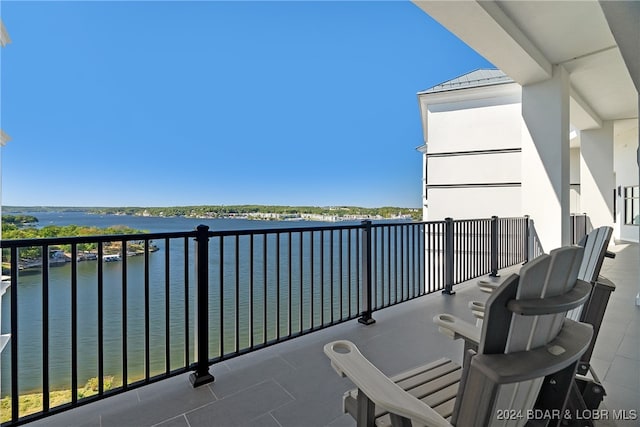 balcony featuring a water view