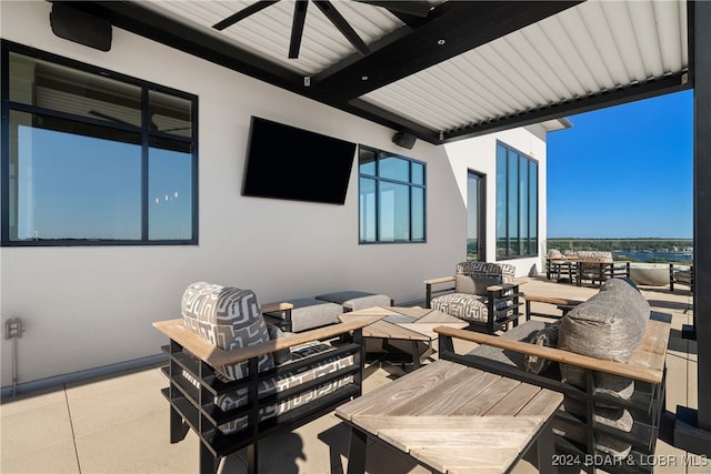 view of patio / terrace with ceiling fan and an outdoor hangout area