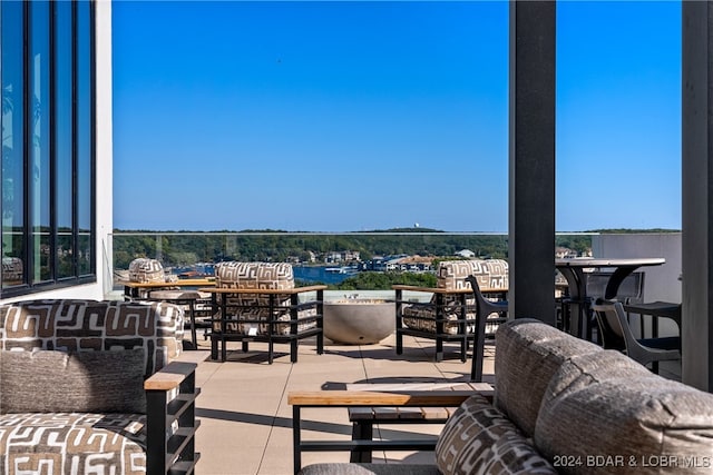 view of patio featuring a water view