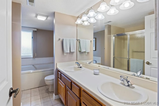 full bathroom featuring vanity, tile patterned floors, toilet, a textured ceiling, and independent shower and bath