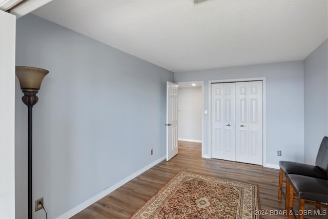 living area with hardwood / wood-style flooring