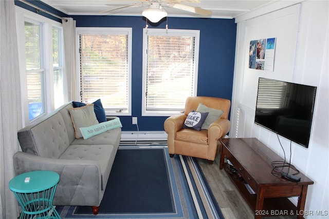 living room with ceiling fan, hardwood / wood-style floors, and a healthy amount of sunlight