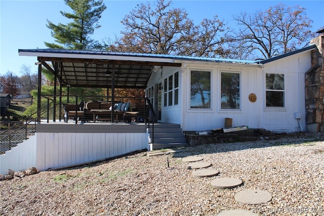 exterior space with an outdoor living space and a wooden deck