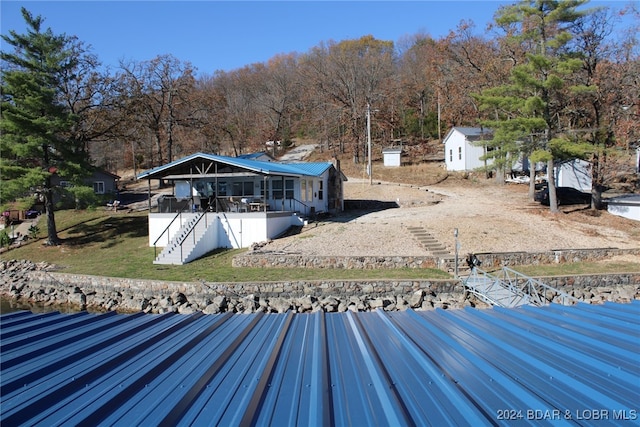 view of dock with a yard