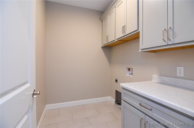 LOT1014 Enclaves Ln, Lake Ozark, MO 65049 - laundry area featuring cabinet space, hookup for a washing machine, hookup for an electric dryer, and baseboards