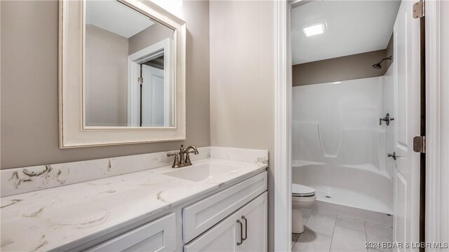 LOT1014 Enclaves Ln, Lake Ozark, MO 65049 - bathroom featuring toilet, vanity, and a shower