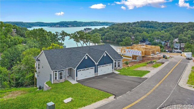 LOT1014 Enclaves Ln, Lake Ozark, MO 65049 - view of subject property featuring a nearby body of water and a heavily wooded area