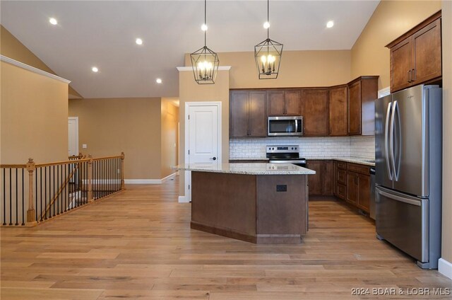 LOT1014 Enclaves Ln, Lake Ozark, MO 65049 - kitchen featuring stainless steel appliances, backsplash, light wood-style floors, a kitchen island, and a chandelier