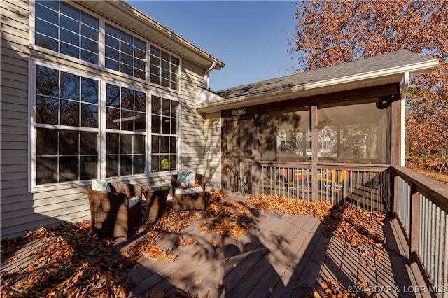 wooden terrace featuring a sunroom