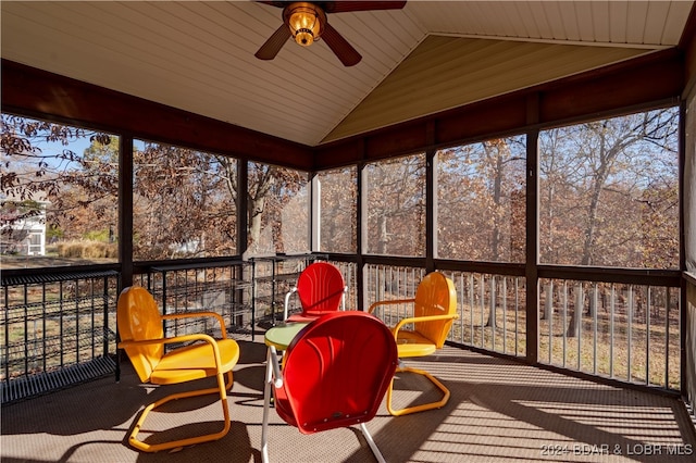 unfurnished sunroom with plenty of natural light, ceiling fan, and lofted ceiling