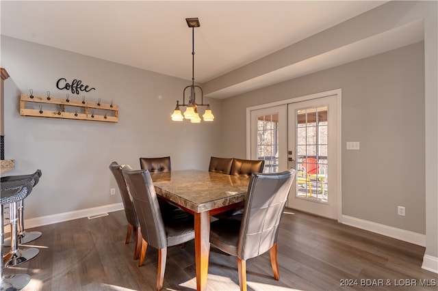 dining space with french doors and dark hardwood / wood-style floors