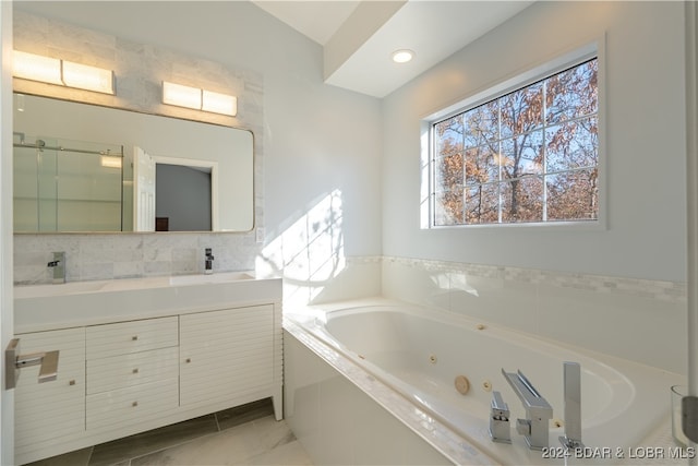 bathroom featuring a bathing tub and vanity