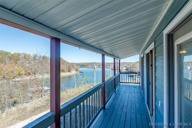 wooden deck with a water view