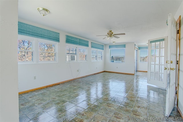 unfurnished room featuring ceiling fan