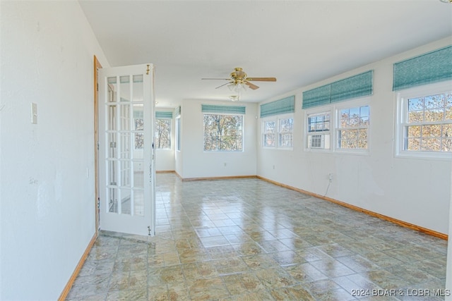 spare room with ceiling fan