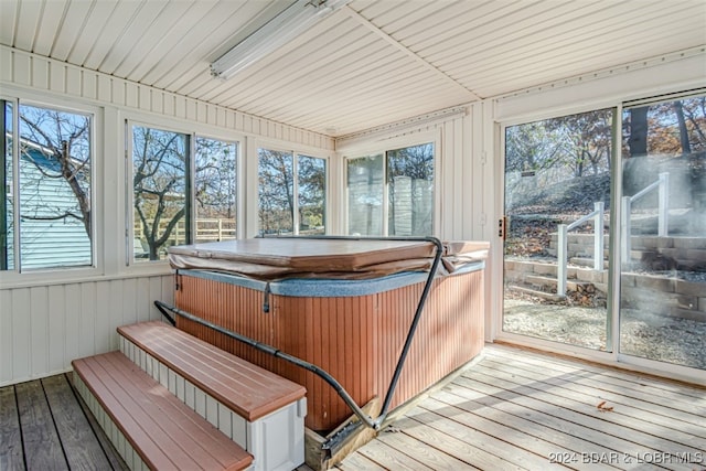 sunroom featuring a jacuzzi