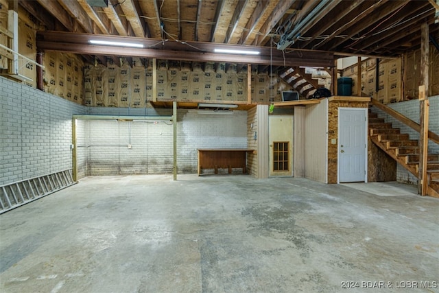 basement with brick wall