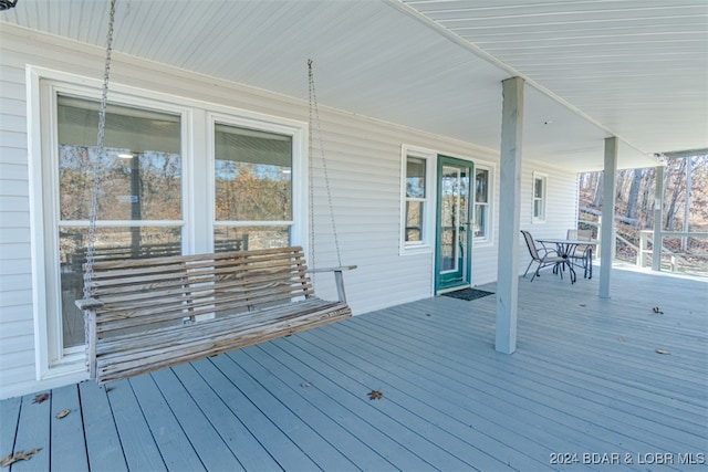 wooden deck featuring covered porch