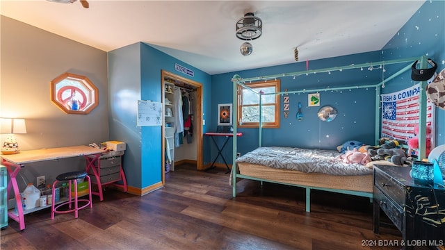 bedroom featuring dark hardwood / wood-style floors and a closet