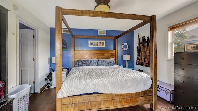 bedroom featuring dark hardwood / wood-style flooring