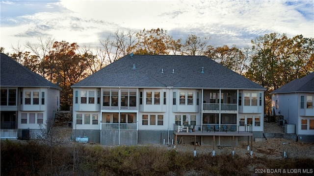 view of back house at dusk