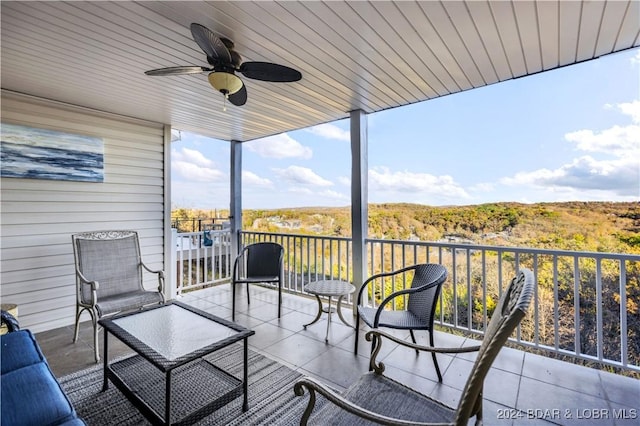 exterior space featuring a ceiling fan