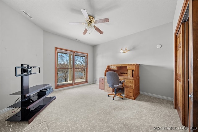 office with light carpet and ceiling fan