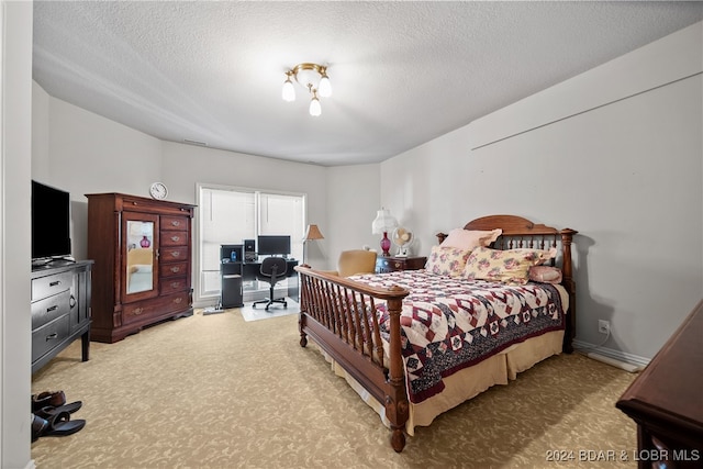 bedroom featuring a textured ceiling