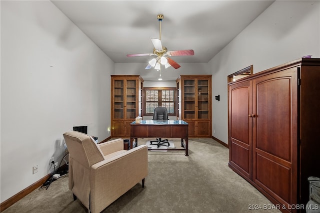 carpeted home office with ceiling fan