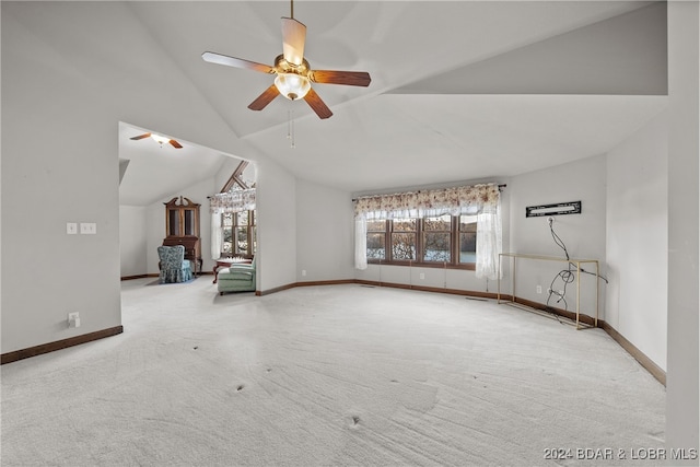 unfurnished living room with carpet floors, ceiling fan, and lofted ceiling