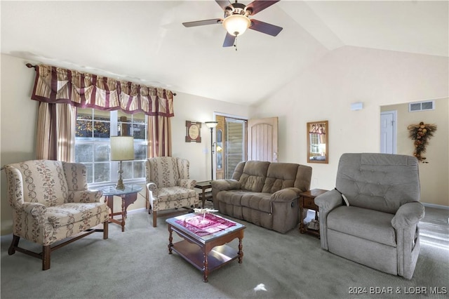 living room with ceiling fan, carpet floors, and vaulted ceiling