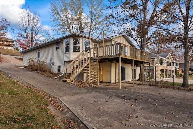 rear view of property with a deck