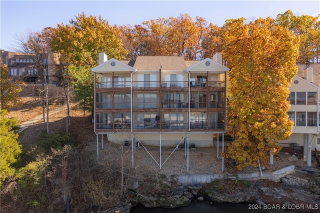 back of property featuring a balcony