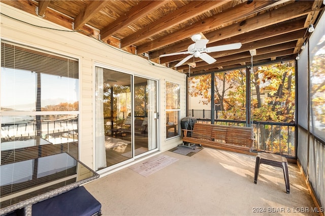 sunroom featuring ceiling fan