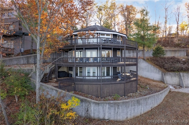 back of house with a wooden deck