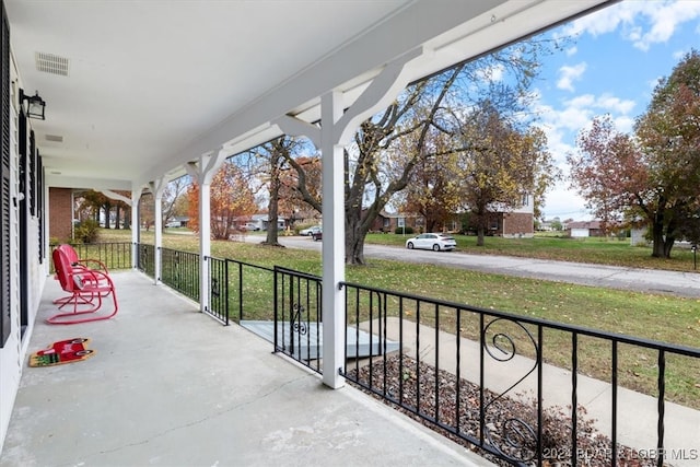 view of patio / terrace with covered porch and visible vents