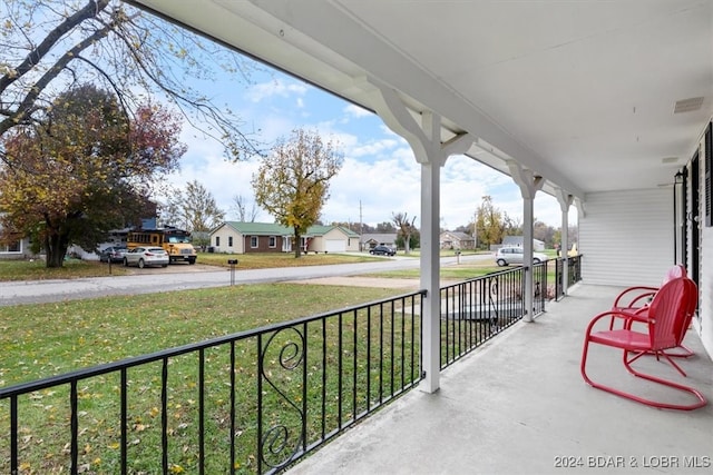 view of patio with a residential view, covered porch, and visible vents