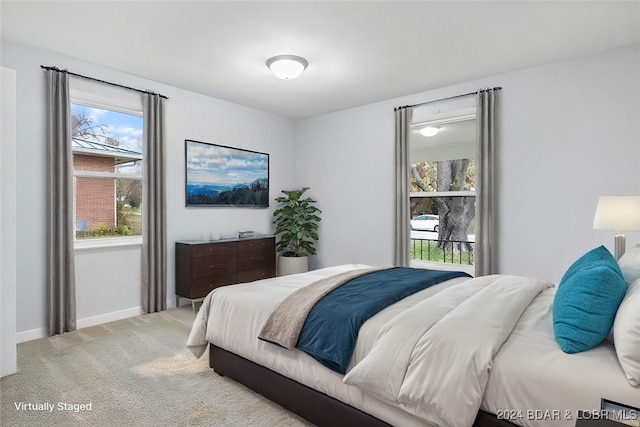 bedroom with carpet floors and baseboards