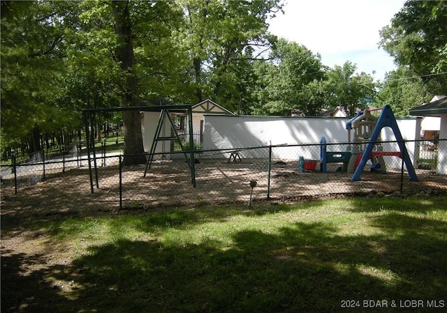 view of playground featuring a lawn