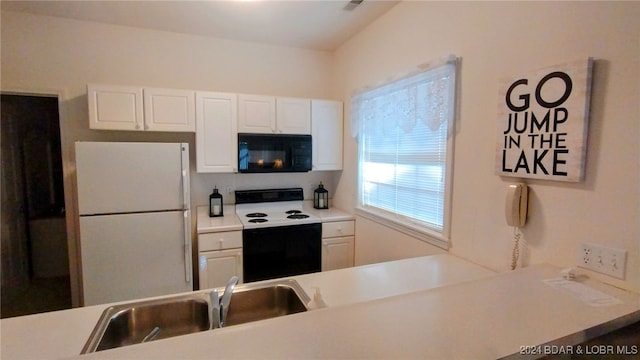 kitchen with white cabinets, white appliances, kitchen peninsula, and sink