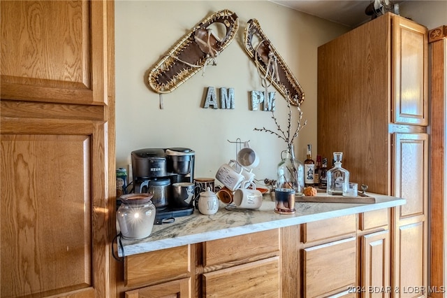 bar featuring light stone counters