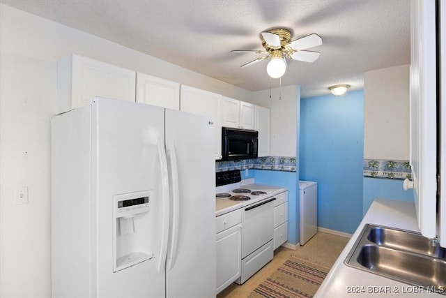 kitchen with white cabinets, a textured ceiling, white appliances, and sink