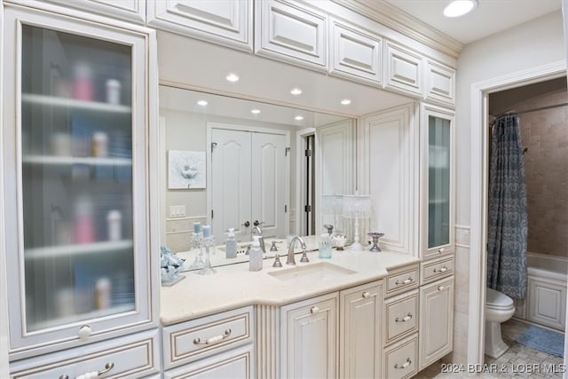 full bathroom with vanity, toilet, and shower / tub combo