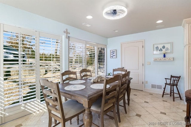 dining space featuring light tile patterned floors