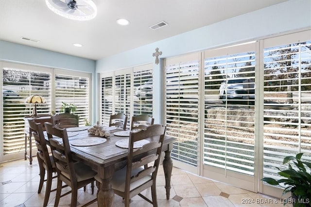 dining room with ceiling fan and light tile patterned flooring