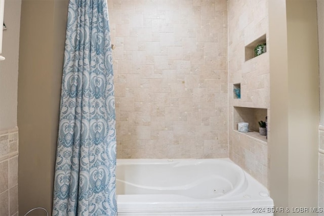 bathroom featuring shower / bathtub combination with curtain